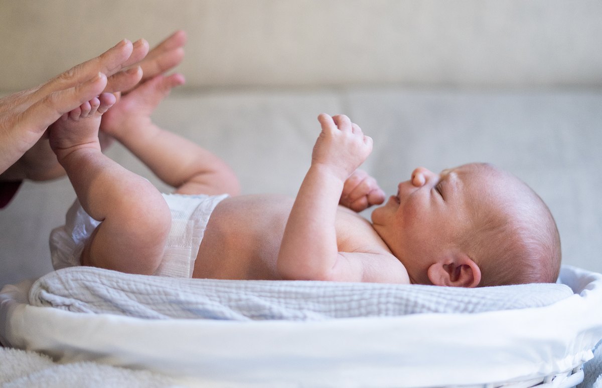 Newborn baby being cared for